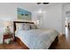 Cozy bedroom with beautiful painting above a bed adorned with decorative pillows at 2405 Louisville St, Charleston, SC 29492