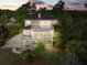 An expansive exterior view featuring a multi-story deck and well-maintained yard at 2444 Darts Cove Way, Mount Pleasant, SC 29466