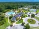 Expansive aerial view of community center, pool, and amenities surrounded by lush greenery and mature trees at 2444 Darts Cove Way, Mount Pleasant, SC 29466