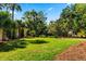 Expansive backyard features lush lawn, mature trees, and space for outdoor activities at 2444 Darts Cove Way, Mount Pleasant, SC 29466