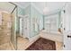 Bright bathroom featuring a glass shower, soaking tub, and ample natural light at 2444 Darts Cove Way, Mount Pleasant, SC 29466