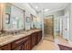 Elegant bathroom featuring double vanity, granite countertops, and a luxurious walk-in shower at 2444 Darts Cove Way, Mount Pleasant, SC 29466