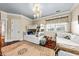 Well-lit bedroom featuring a bunk bed, daybed, hardwood floors, and elegant chandelier at 2444 Darts Cove Way, Mount Pleasant, SC 29466
