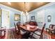 Formal dining room with wood floors, elegant lighting, and traditional decor at 2444 Darts Cove Way, Mount Pleasant, SC 29466