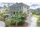 Stately two-story home features a large front porch and three-car garage at 2444 Darts Cove Way, Mount Pleasant, SC 29466
