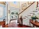 Elegant foyer with hardwood floors, staircase, and detailed trim at 2444 Darts Cove Way, Mount Pleasant, SC 29466