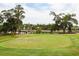 Picturesque golf course view featuring a well-maintained green and natural landscaping at 2444 Darts Cove Way, Mount Pleasant, SC 29466