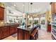 Bright kitchen featuring granite countertops, tile flooring, and pendant lighting above the central island at 2444 Darts Cove Way, Mount Pleasant, SC 29466