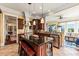 Spacious kitchen features a central island, granite countertops, and stainless steel appliances at 2444 Darts Cove Way, Mount Pleasant, SC 29466