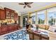Sunny living space featuring a bar area with dark wood cabinets and direct access to porch at 2444 Darts Cove Way, Mount Pleasant, SC 29466
