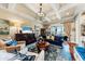 Comfortable living area showcasing hardwood floors, a coffered ceiling, and natural lighting at 2444 Darts Cove Way, Mount Pleasant, SC 29466