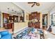 Inviting living room adjoining kitchen with dark wood cabinetry and lots of natural light at 2444 Darts Cove Way, Mount Pleasant, SC 29466