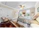 Bright main bedroom with hardwood floors, ceiling fan, and large windows providing plenty of natural light at 2444 Darts Cove Way, Mount Pleasant, SC 29466