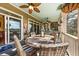 Inviting covered patio featuring a dining table with seating and outdoor views at 2444 Darts Cove Way, Mount Pleasant, SC 29466