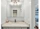 Updated bathroom with a marble countertop vanity, modern fixtures, and tile flooring at 248 Forest Trail, Isle of Palms, SC 29451