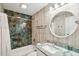 Stylish bathroom with unique wall tiles, a modern vanity, and a bathtub with shower at 248 Forest Trail, Isle of Palms, SC 29451