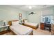Cozy bedroom with twin beds, a desk, and soft lighting at 248 Forest Trail, Isle of Palms, SC 29451