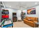 Fun game room with an air hockey table, arcade game, and a comfortable seating area at 248 Forest Trail, Isle of Palms, SC 29451