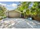 Detached garage featuring a basketball hoop and a spacious driveway at 248 Forest Trail, Isle of Palms, SC 29451
