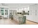 Bright kitchen with white cabinets, stainless appliances and a large green marble island at 248 Forest Trail, Isle of Palms, SC 29451