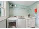 Laundry room featuring modern washer and dryer appliances and ample counter space at 248 Forest Trail, Isle of Palms, SC 29451