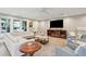 Bright living room with a large sectional sofa, providing plenty of space for entertaining and relaxing at 248 Forest Trail, Isle of Palms, SC 29451