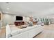 Expansive open-concept living room featuring light-colored walls, recessed lighting, and hardwood floors at 248 Forest Trail, Isle of Palms, SC 29451