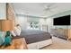 Comfortable bedroom featuring a ceiling fan, light walls and view to the outdoors at 248 Forest Trail, Isle of Palms, SC 29451