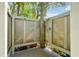 Relaxing outdoor shower featuring natural wood tones that complement the lush greenery around the property at 248 Forest Trail, Isle of Palms, SC 29451