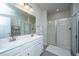 Modern bathroom with double vanity, large mirror, and glass-enclosed shower at 249 Oak View Way, Summerville, SC 29483