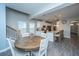 Dining area with wood table next to stairs and open concept kitchen at 249 Oak View Way, Summerville, SC 29483