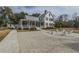 Stately white home with a metal roof, spacious front yard, and ample seating creating an inviting outdoor space at 249 Oak View Way, Summerville, SC 29483