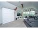 Spacious and bright living room featuring a large gray sectional sofa, TV and a home theater system at 249 Oak View Way, Summerville, SC 29483