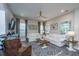 Cozy living room with neutral tones, wood floors, comfortable seating, and ample natural light at 249 Oak View Way, Summerville, SC 29483