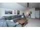 Spacious living room featuring a large gray sectional sofa, a wood coffee table, and Marvel themed decorations at 249 Oak View Way, Summerville, SC 29483
