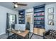 Office with custom built-in shelving, a wood desk, and plenty of natural light, perfect for remote work at 249 Oak View Way, Summerville, SC 29483