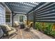 Outdoor patio featuring an elegant pergola, comfortable seating, and a modern fire pit at 249 Oak View Way, Summerville, SC 29483