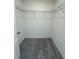 A bright, empty closet with metal shelving and gray carpet at 2605 Scarlett Maple St, Summerville, SC 29486