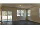 Bright living room with slider and large window to back, offering seamless indoor/outdoor lifestyle at 2605 Scarlett Maple St, Summerville, SC 29486
