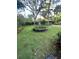 Spacious backyard with lush lawn, planting area, and a basketball court offers ample outdoor space at 27 Stocker Dr, Charleston, SC 29407
