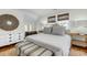 Bright bedroom with natural light, a round mirror, and wooden accents creating a cozy and stylish retreat at 27 Stocker Dr, Charleston, SC 29407