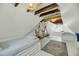 Attic bedroom with hardwood floors, exposed beams, and cozy bed nooks at 27 Stocker Dr, Charleston, SC 29407