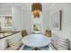 Breakfast nook featuring a marble table, comfortable bench seating and a modern chandelier at 27 Stocker Dr, Charleston, SC 29407