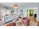 Bright living room showcases stylish decor, hardwood floors and comfortable seating at 27 Stocker Dr, Charleston, SC 29407