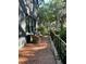 Charming brick patio with outdoor seating area and wrought iron railing creates a relaxing outdoor space at 27 Stocker Dr, Charleston, SC 29407