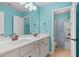 Well-lit bathroom featuring double sinks, large mirror, and neutral tile, with shower/tub combo at 2840 Conservancy Ln, Charleston, SC 29414