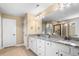 Bright bathroom with granite countertops, double sinks, white cabinets, and a glass enclosed shower at 2840 Conservancy Ln, Charleston, SC 29414