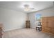 Neutral bedroom with a ceiling fan, a rocking chair, a window with blinds, and nice furnishings at 2840 Conservancy Ln, Charleston, SC 29414