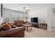 Cozy living room with a large TV, comfortable seating, and lots of natural light at 2840 Conservancy Ln, Charleston, SC 29414