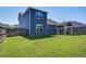 Spacious backyard featuring a well-maintained lawn, wooden fence, and a covered patio at 2880 Cavalcade Cir, Johns Island, SC 29455
